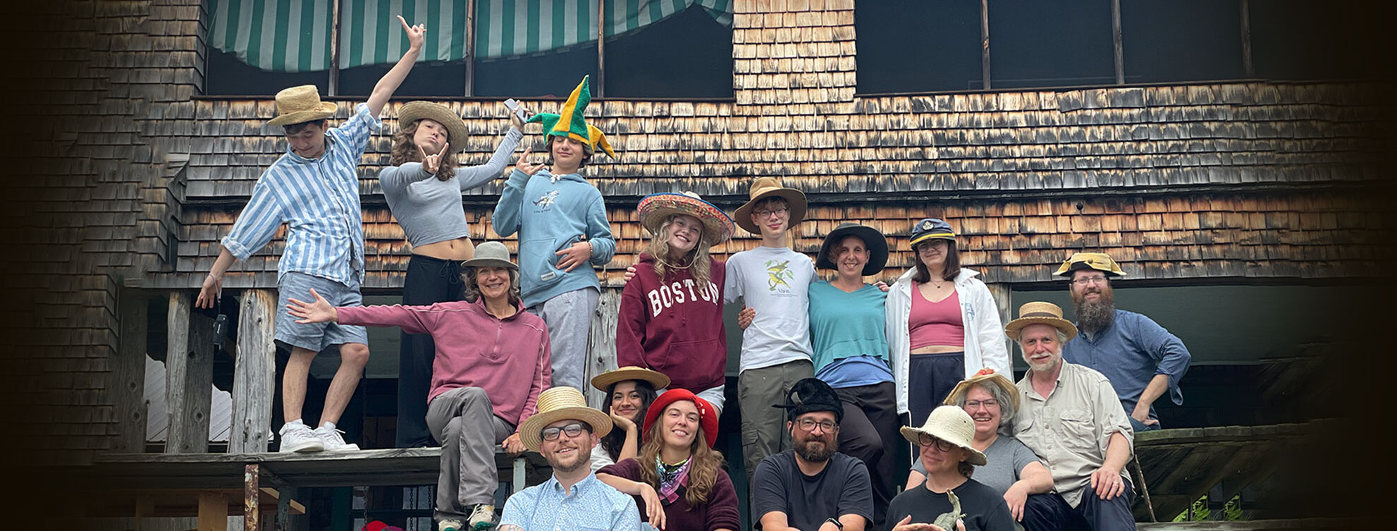 A group of people standing together in front of a house.